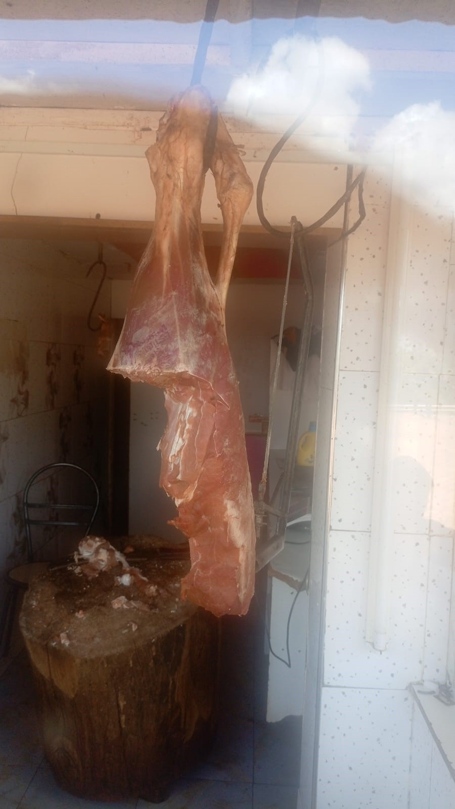 Fresh meat hanging in the butchery
